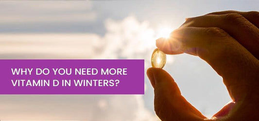 Hand holding vitamin D supplement capsule against winter sunlight, promoting Phlox wellness.